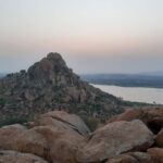 Breathtaking view from Kuntibetta Peak, featuring rolling hills and valleys.